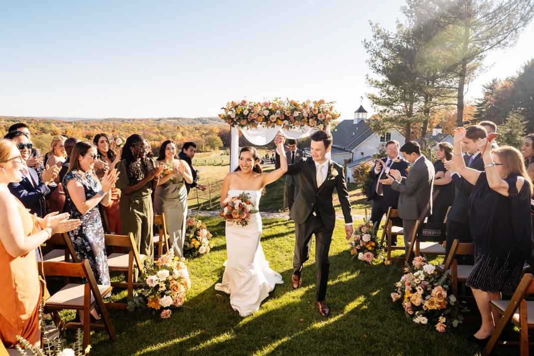 Milea Estate: The Perfect Hudson Valley Wedding Venue 4 Outdoor NY vineyard wedding ceremony with rows of grapevines at Milea Estate