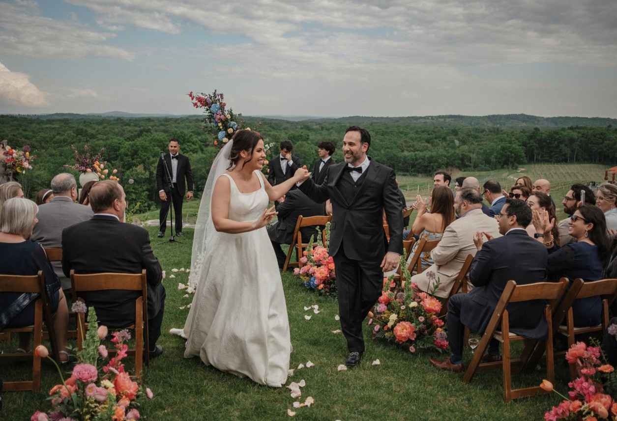 Milea Estate: The Perfect Hudson Valley Wedding Venue 5 Romantic vineyard wedding in NY couple portrait among Milea Estate vines